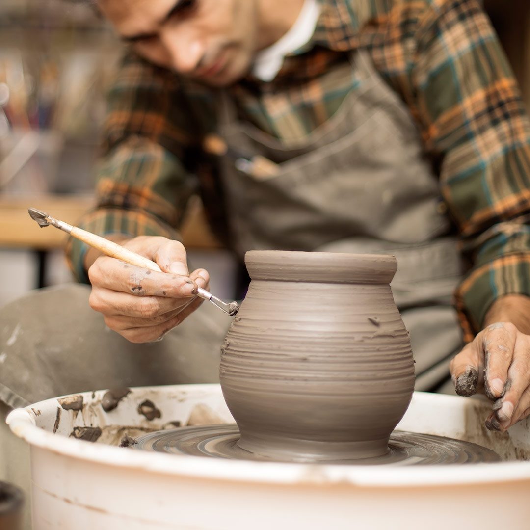 artist-makes-clay-pottery-on-a-spin-wheel-2022-04-14-08-00-30-utc.jpg